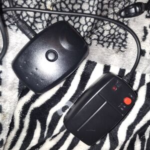 Black Electronic Device with Red Button
